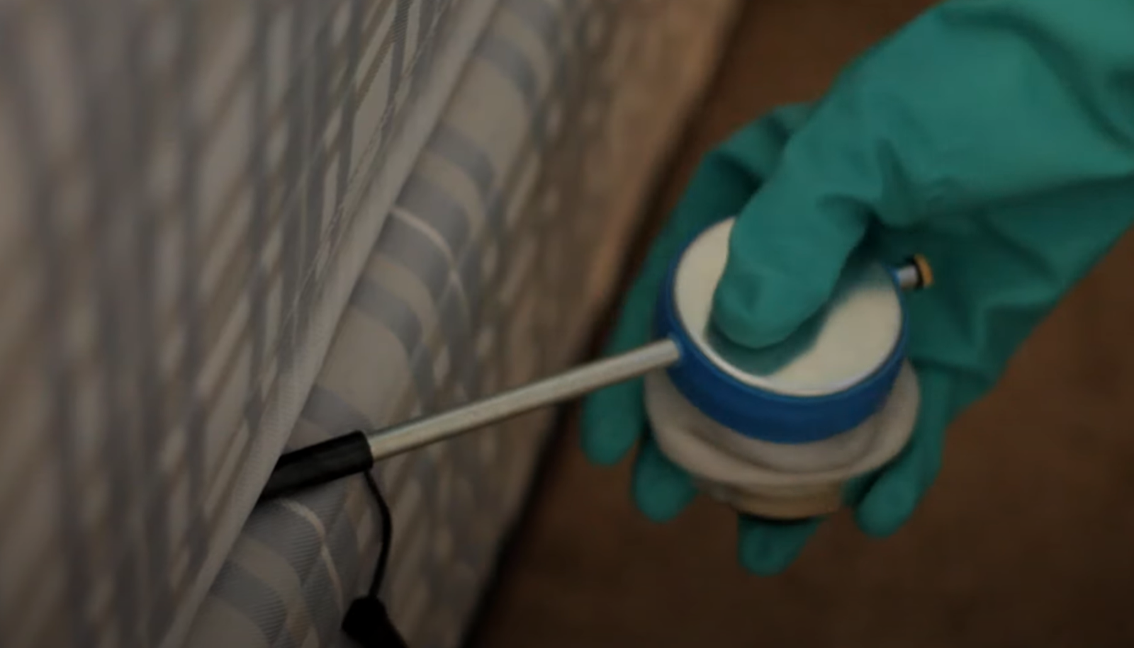 Professional applying treatment to a mattress seam — Pest Control Service in Davis for bed bug removal.